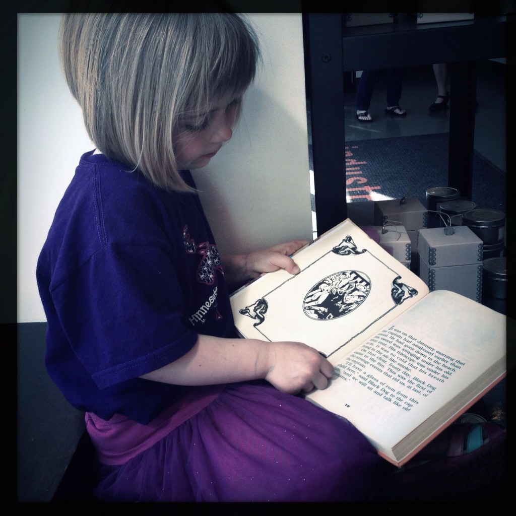 Stella reading Treasure Island